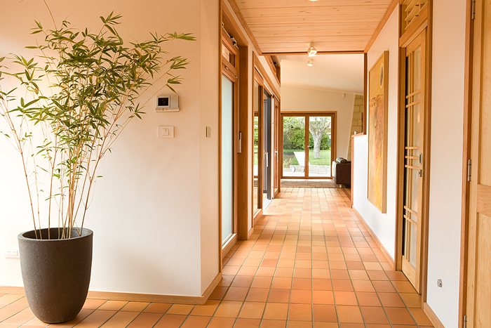Tiled hallway with timber framed glass doors