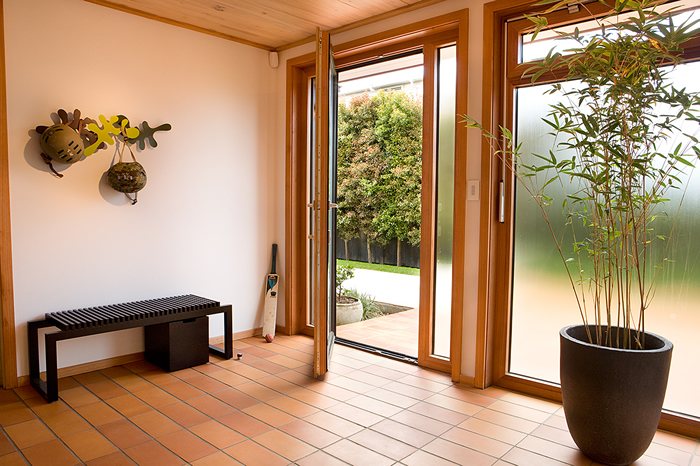 Entry with tiled floor and timber framed glazed doors